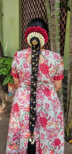 Bridal braid decorated with jasmine and roses