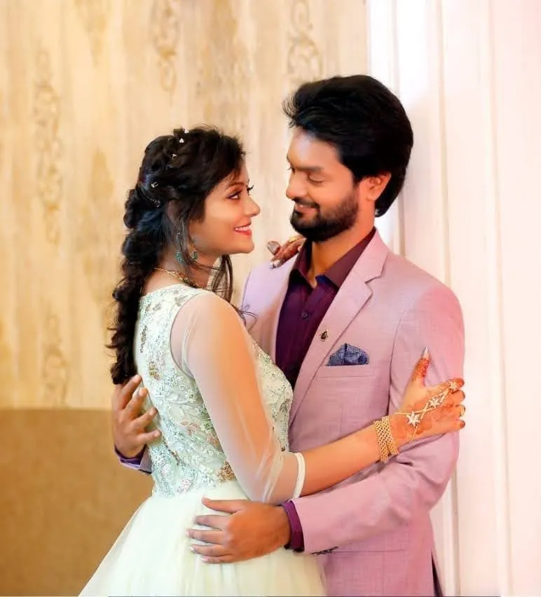 Couple in engagement outfits posing together